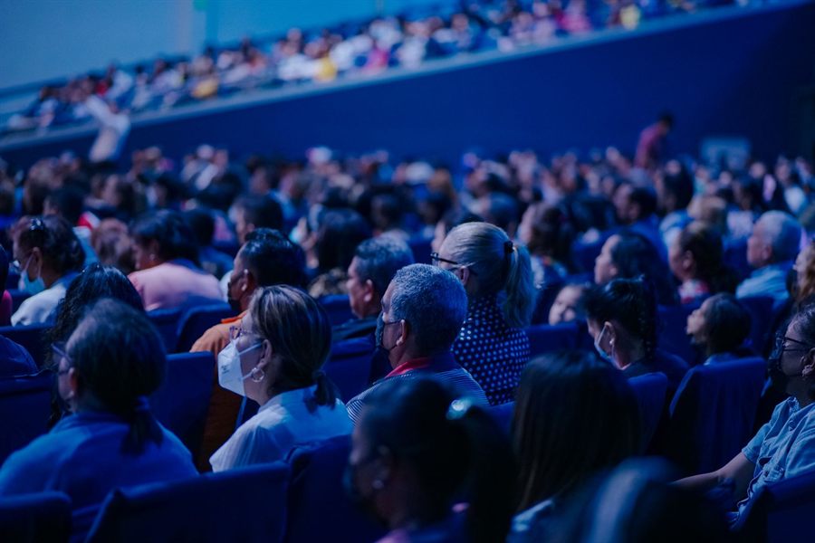 Large audience in rows at a conference hall