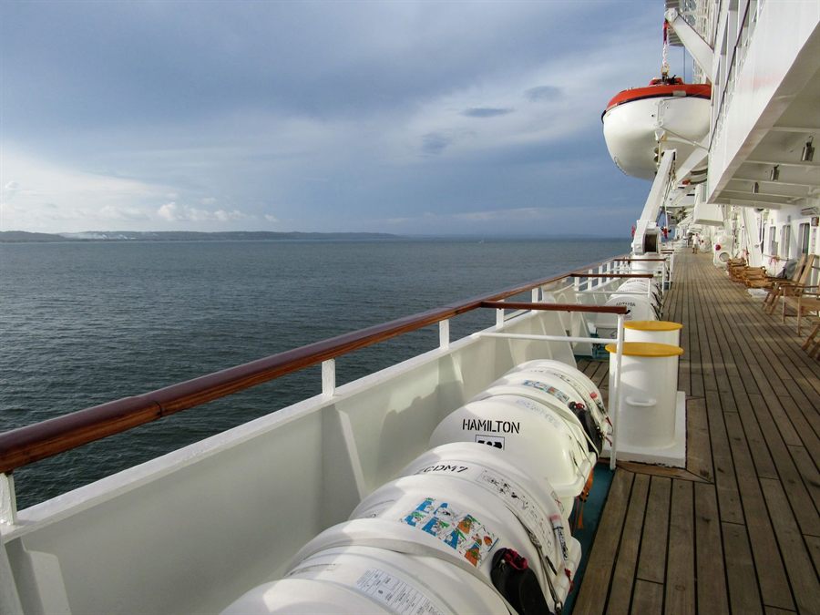 Teak promenade deck along the rail of a cruise ship