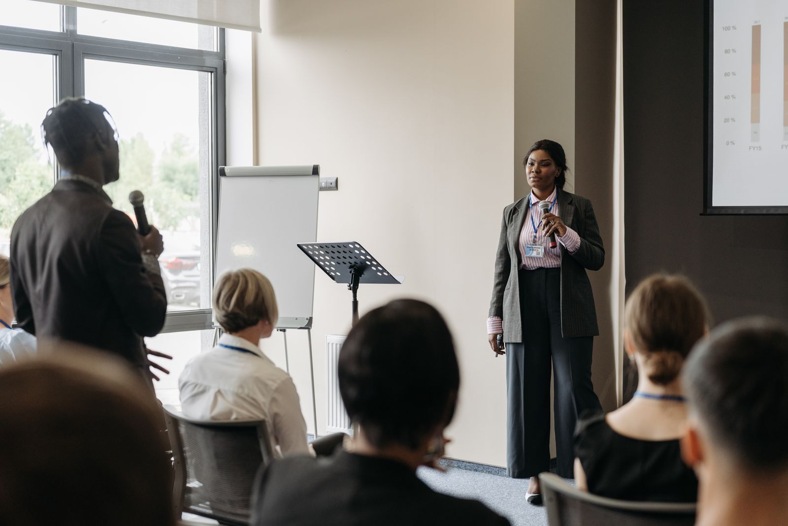 Speaker presenting to a small group in a bright training room