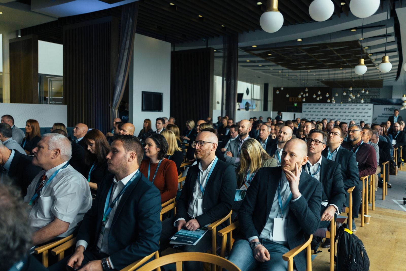 Travel professionals seated at an industry conference, the setting where many a master cruise counselor earns credits