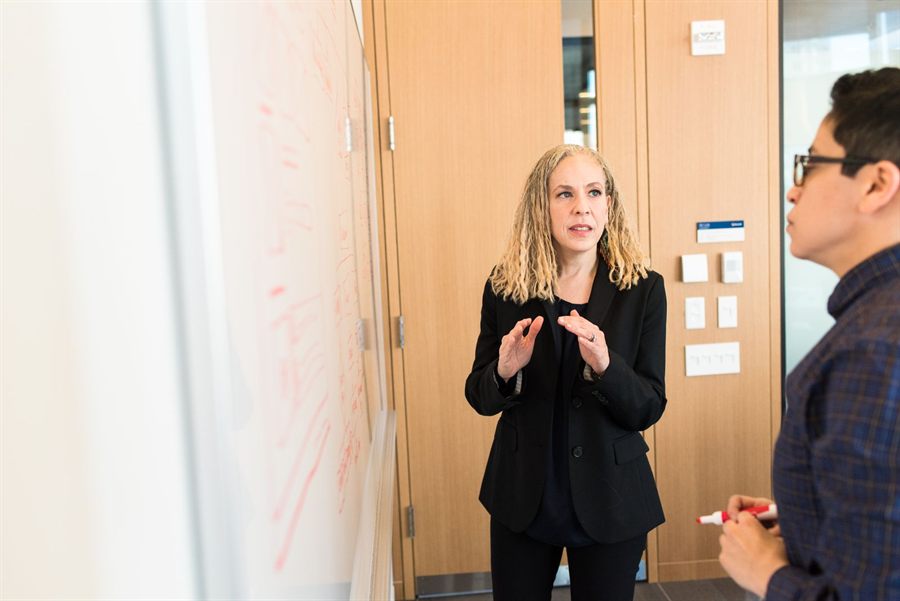 Two colleagues at a whiteboard